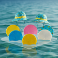 Swimming caps with ocean background